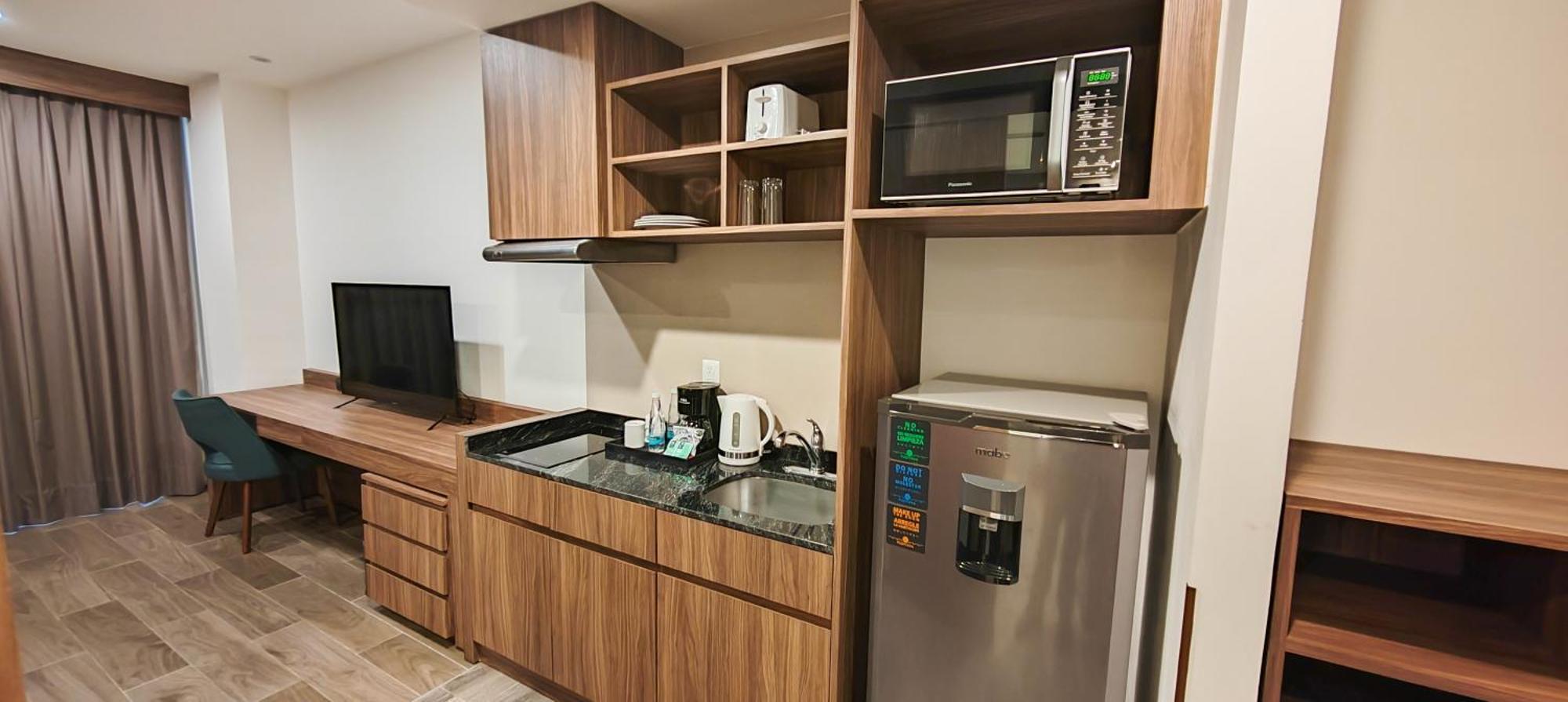 Fujitaya Queretaro Hotel Exterior photo A kitchenette in a hotel room